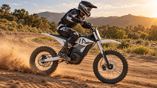 A rider accelerating a white and black MUDLIZ 6000W electric dirt bike on a private dirt track