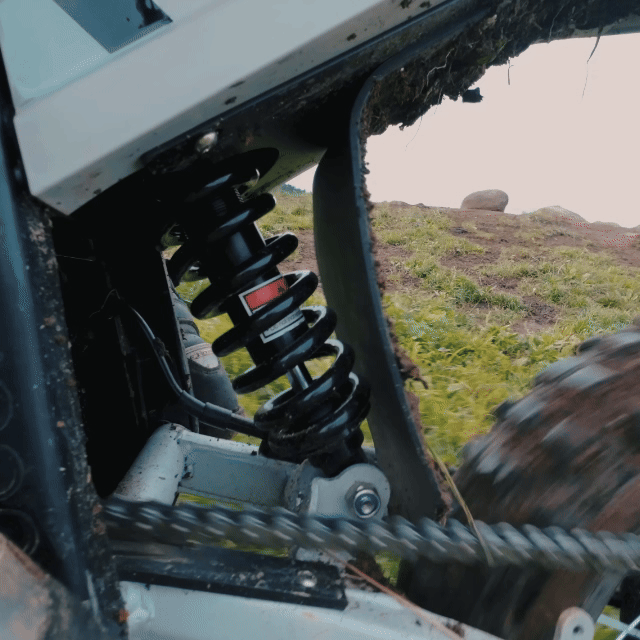 Mudliz electric dirt bike rear suspension in motion